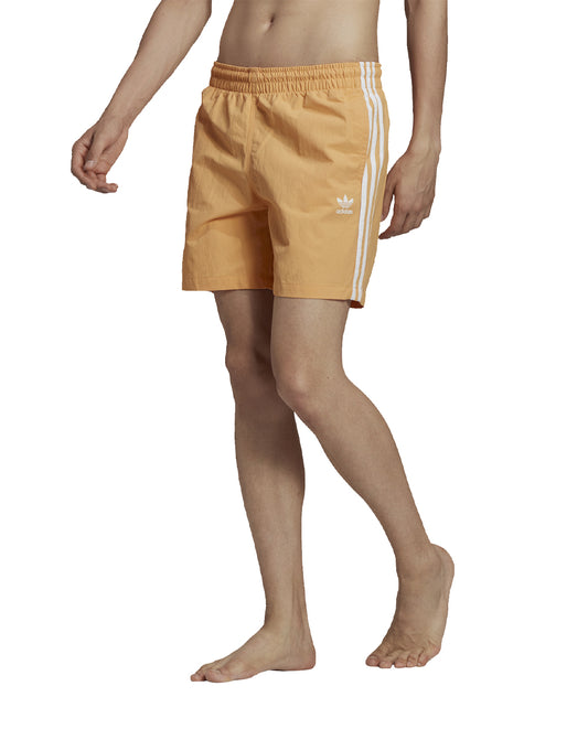 Adidas Orange Shorts with White Stripes